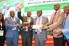 Prof-Ndetei-receives-the-National-Outstanding-Research-Award-from-Prof-Ratemo-Michieka-